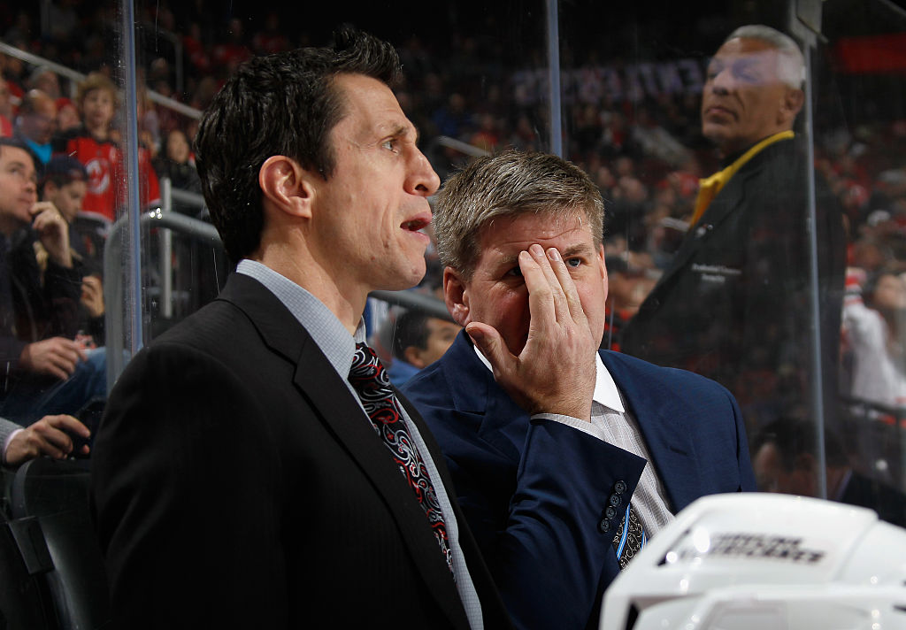 NEWARK, NJ - MARCH 01: Head coach Bill Peters of the Carolina Hurricanes speaks with assistant coach Rob Brind'Amour during the first period against the New Jersey Devils at the Prudential Center on March 1, 2016 in Newark, New Jersey.  (Photo by Bruce Bennett/Getty Images)