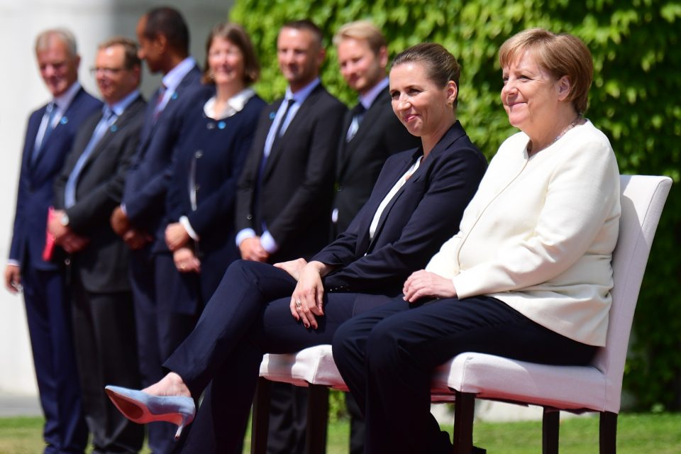 epa07709520 German Chancellor Angela Merkel (R) and Danish Prime Minister Mette Frederiksen (L) sit during a reception with military honors at the Chancellery in Berlin, Germany, 11 July 2019. German Chancellor Angela Merkel and Danish Prime Minister Mette Frederiksen meet for bilateral talks.  EPA-EFE/CLEMENS BILAN