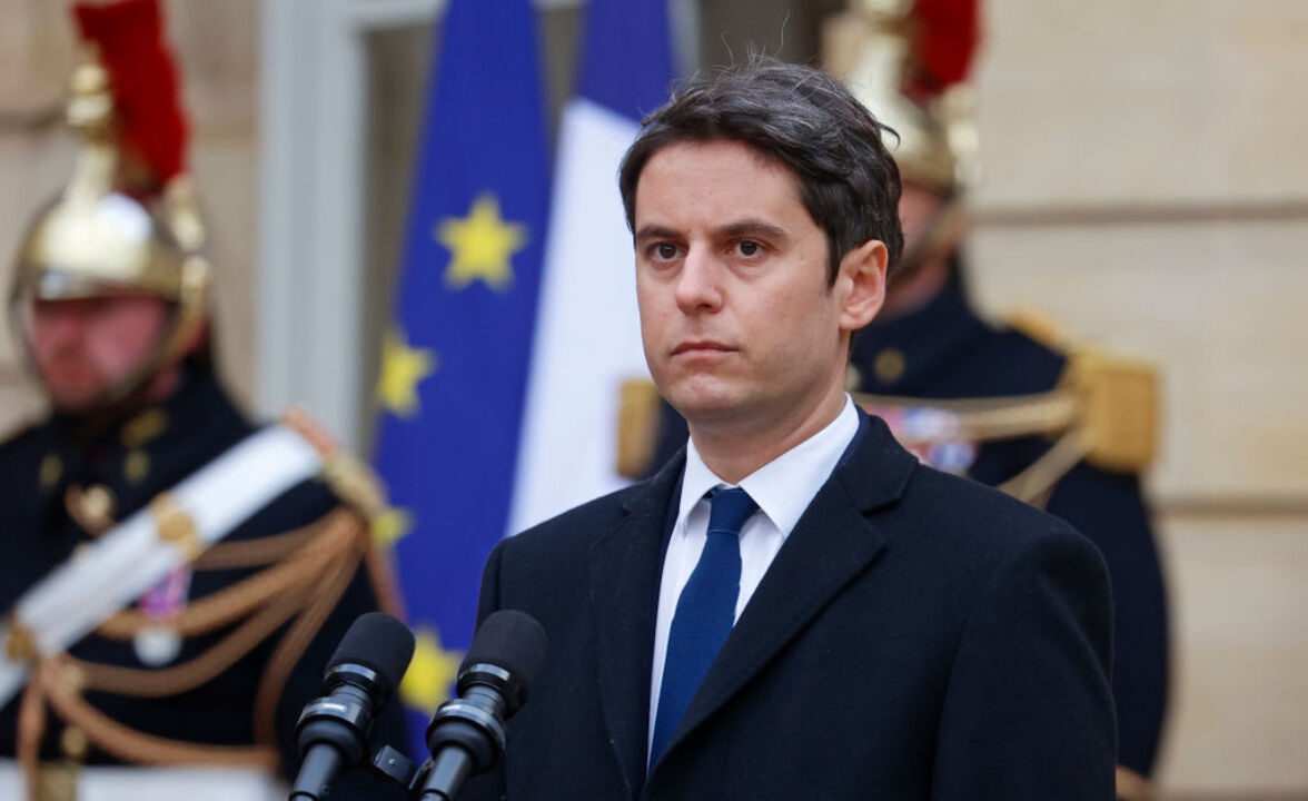 PARIS, FRANCE - JANUARY 09: France's newly appointed Prime Minister, Gabriel Attal listens to the speech of outgoing Prime minister Elisabeth Borne during the handover ceremony in the courtyard of the Hotel de Matignon on January 09, 2024 in Paris, France. French Prime Minister Elisabeth Borne resigned in a move that paves the way for a cabinet reshuffle as President Emmanuel Macron aims to give his presidency new momentum, just five months ahead of the European Parliament elections. Gabriel Attal, 34 years