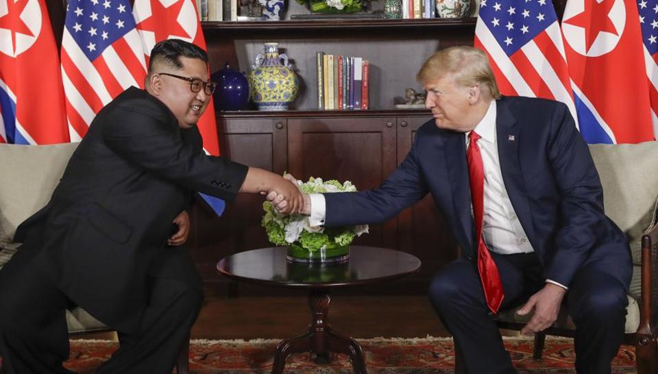 Trump-Kim summit: US president and North Korea leader sign document after meeting