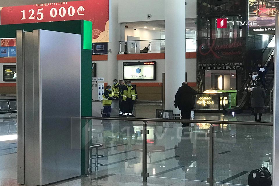 Medics examine passengers at Tbilisi International Airport