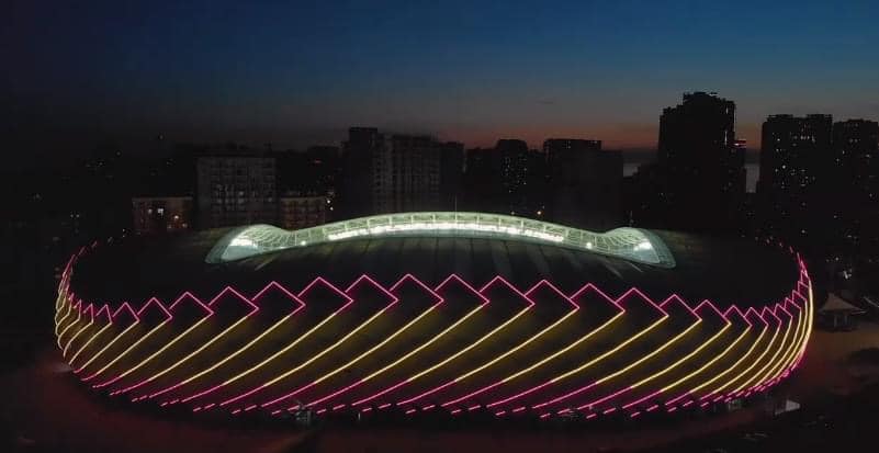 Batumi stadium lit up with flags of the USA, Italy and Spain