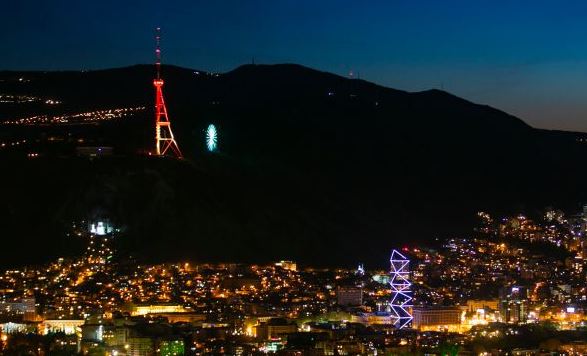 Tbilisi TV tower lit up with the colours of German flag