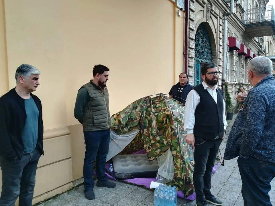 Representatives of “I love Batumi” set up tent outside Adjara TV