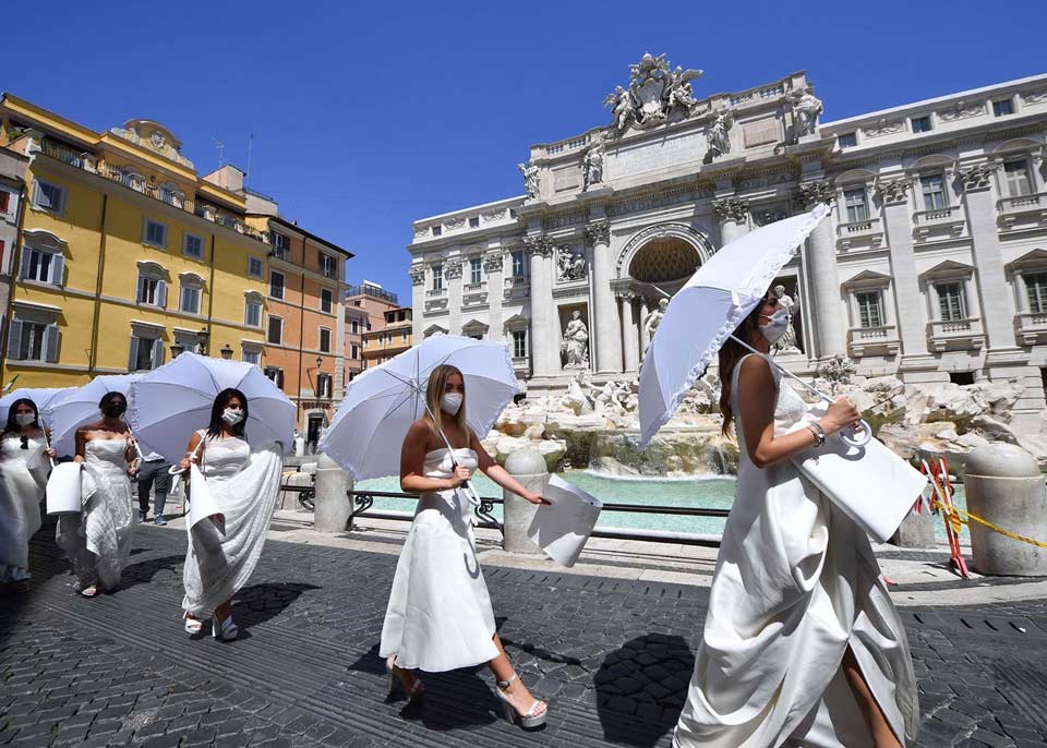 Brides in gowns stage protest in Rome for delayed weddings