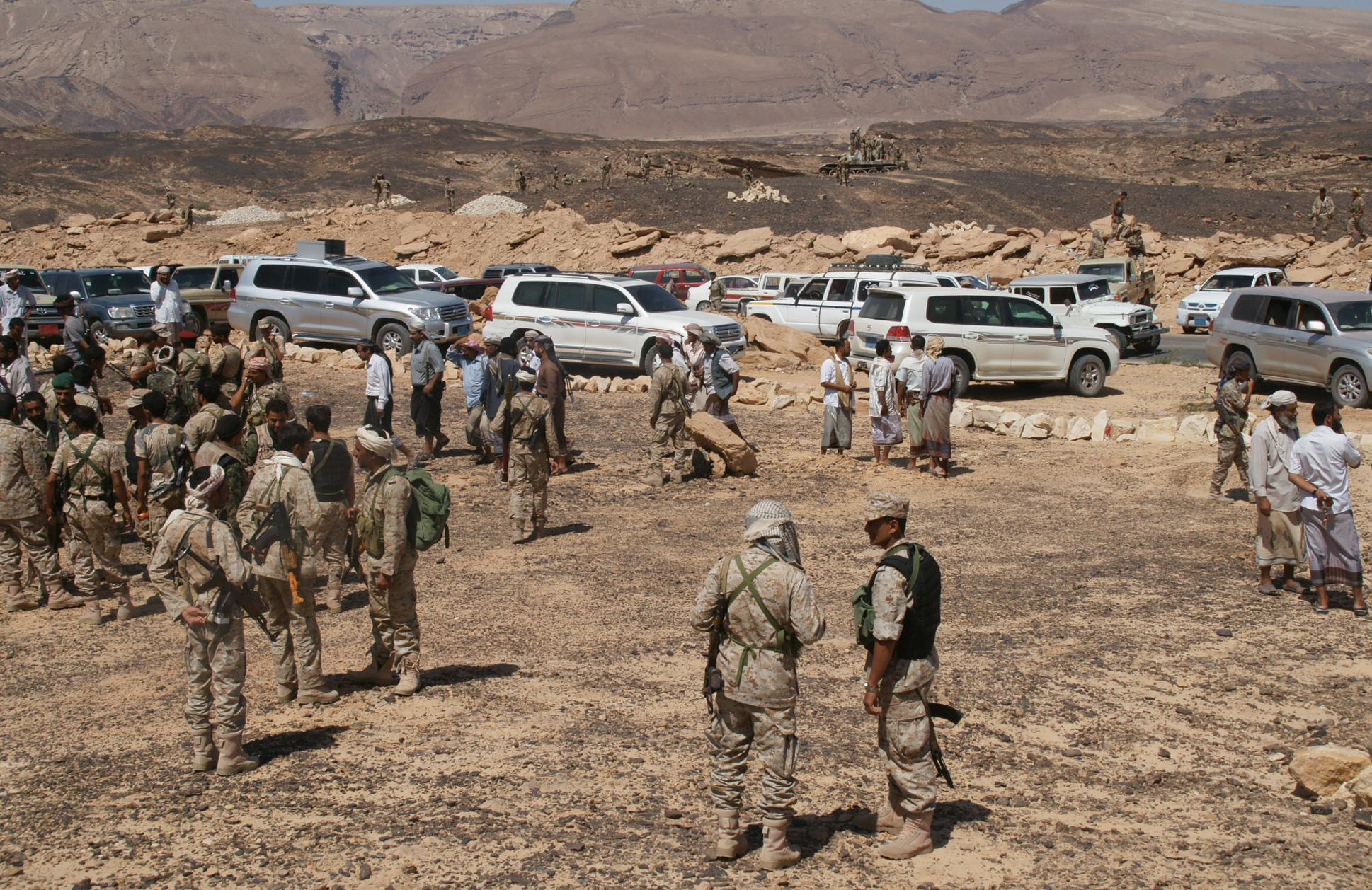 Yemeni soldiers re-group after taking control of a major Al-Qaeda stronghold Azzan in the southern province of Shabwa, on May 8, 2014. Yemen's army seized control of Azzan as an offensive against militants entered its tenth day, the defence ministry announced. AFP PHOTO / STR / AFP / STR (Photo credit should read STR/AFP via Getty Images)